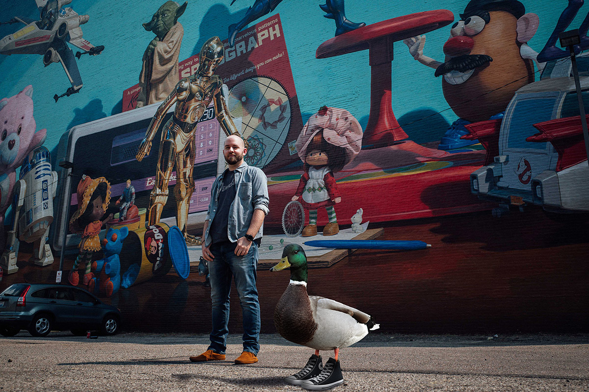 Rob Henderson standing with a duck